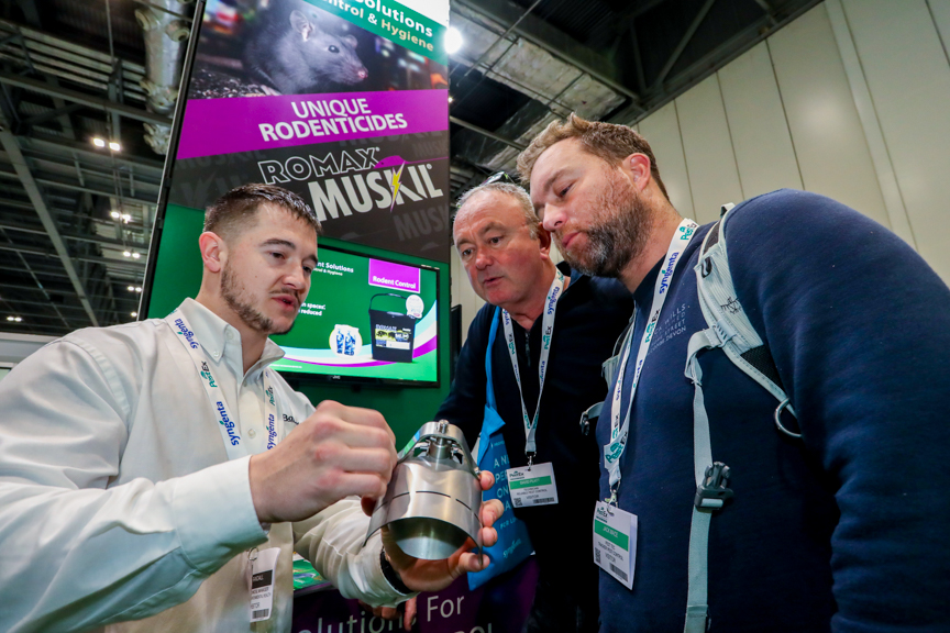 P-3451 PestEx exhibitors showing of their pest prevention products to some UK vistors